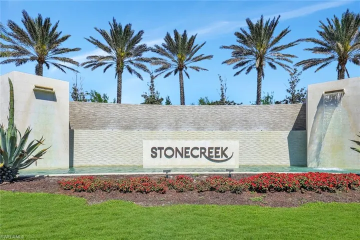 Community / neighborhood sign with a lawn