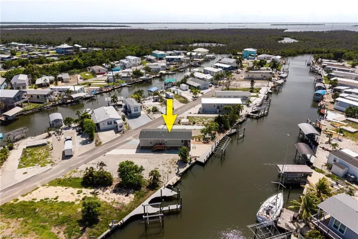 Aerial view facing east with direct gulf access.