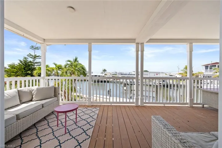 Covered outdoor deck with canal front views to enjoy the island breezes and wildlife.