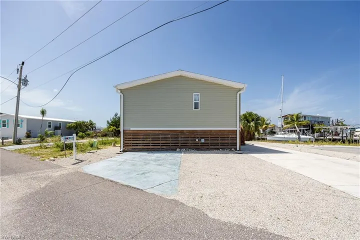 Street front view of home with ample parking.