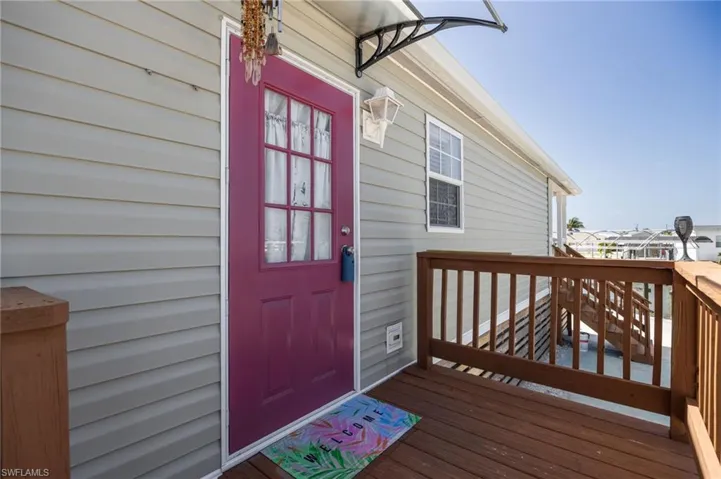 Side entry with stairs and deck.