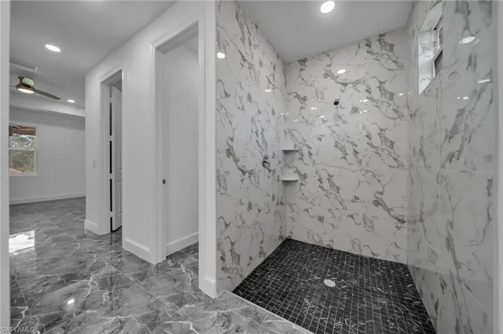 Bathroom featuring a marble finish shower, baseboards, ceiling fan, marble finish floor, and recessed lighting