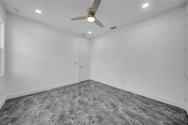 Spare room with baseboards, visible vents, ceiling fan, and recessed lighting