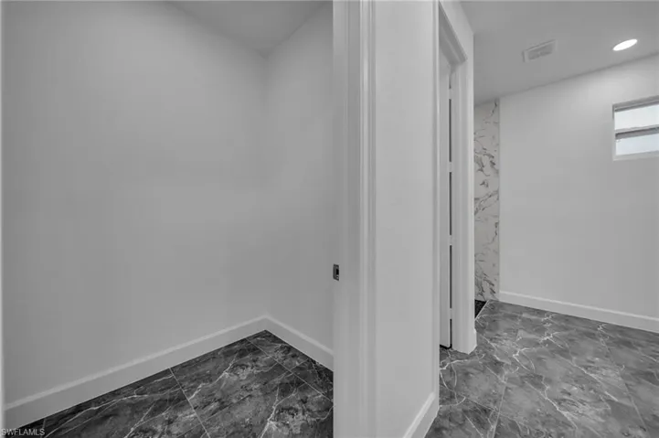 Bathroom featuring marble finish floor, baseboards, visible vents, and recessed lighting
