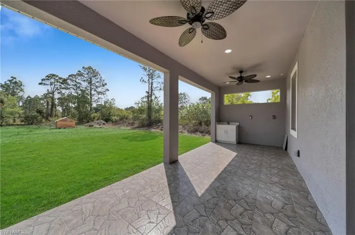View of patio featuring a ceiling fan