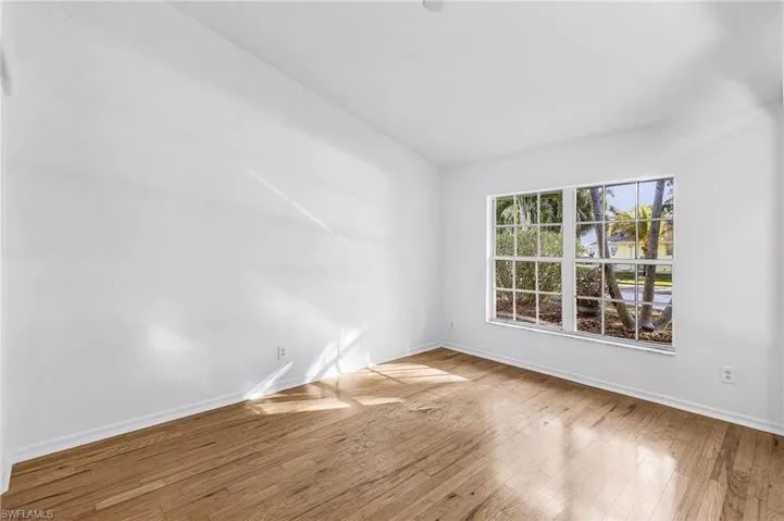 Unfurnished room featuring baseboards and light wood-type flooring