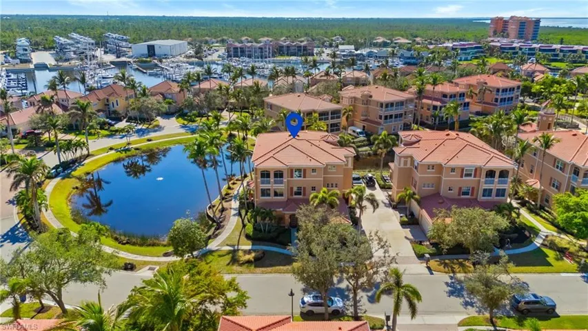 Drone / aerial view with a residential view and a water view