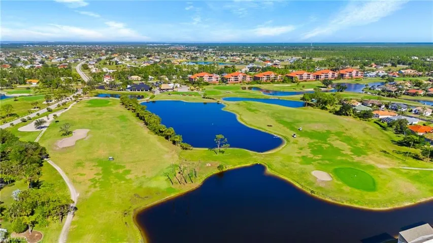 Birds eye view of property with a residential view, golf course view, and a water view