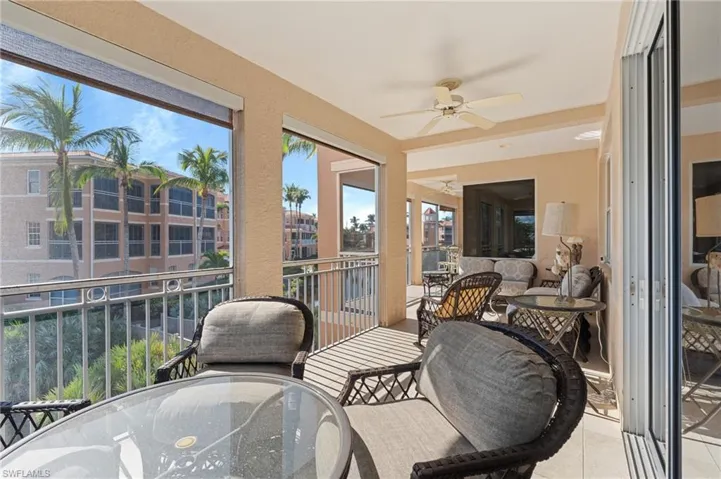 Sunroom / solarium with an outdoor hangout area, ceiling fan, and outdoor dining area