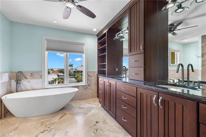 Master bathroom with dual vanities and soaking tub.