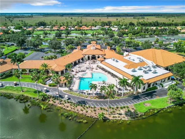 Drone / aerial view of a large body of water and a pool area