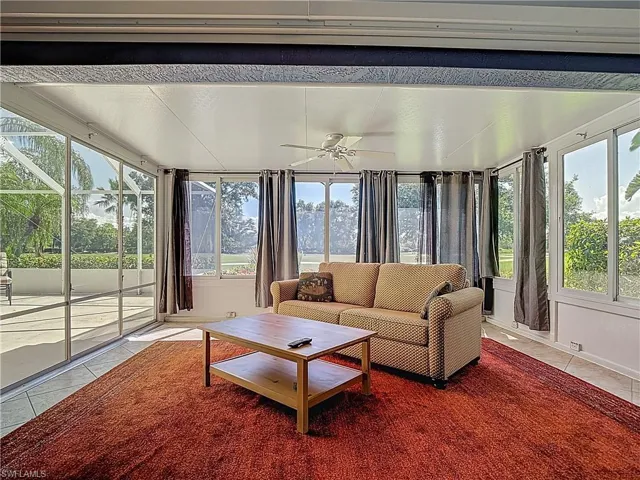 Sunroom / solarium with tile patterned floors