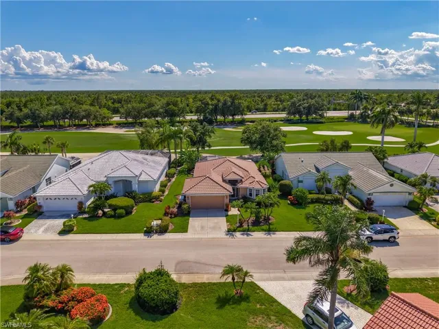 Aerial view of residential area with a golf club