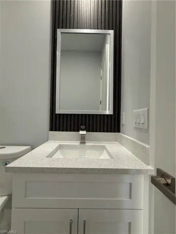 Half bath with toilet and vanity