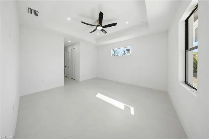 Spare room featuring a ceiling fan and recessed lighting