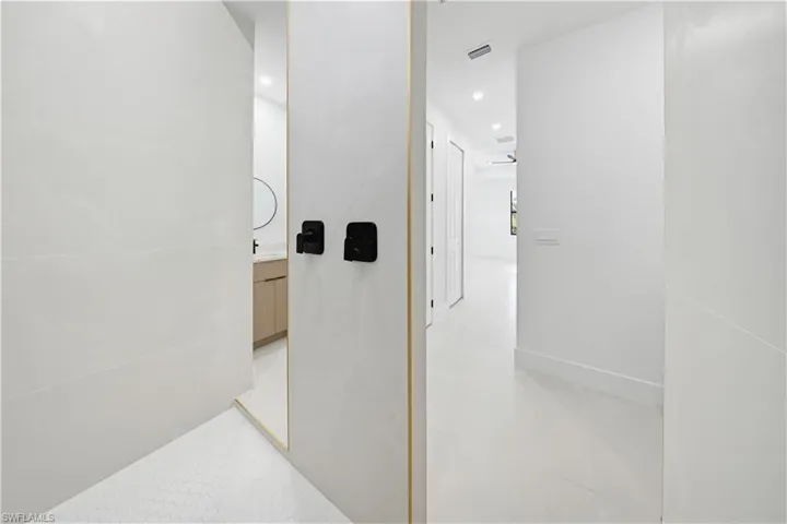 Corridor featuring recessed lighting
