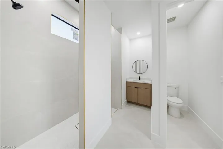 Bathroom featuring vanity and a walk in shower