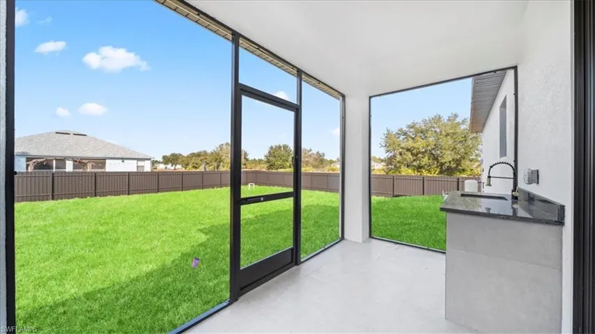 Unfurnished sunroom with a sink