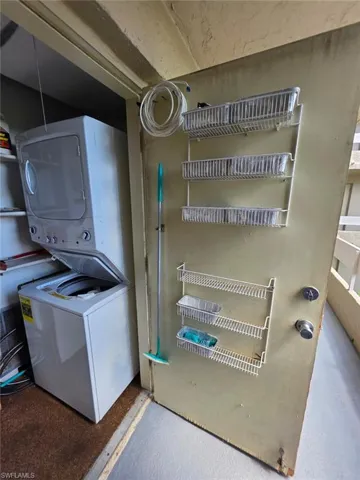 Washroom with estacked washer and dryer