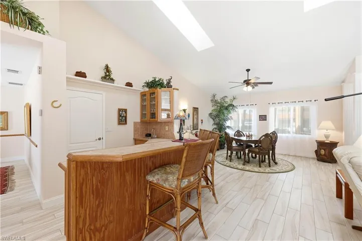 Living Room is featuring a TV viewing area, a full Wet Bar with Sink and Refrigerator, a game Table for your poker friends.