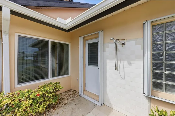 View of the door to the Pool bath, new window and glass blocks.