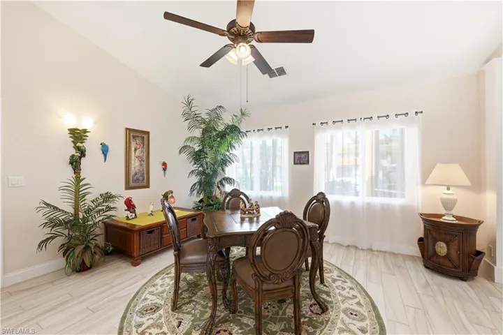 Part of the Living Room is furnished with a game table for a friendly poker game with your friends.