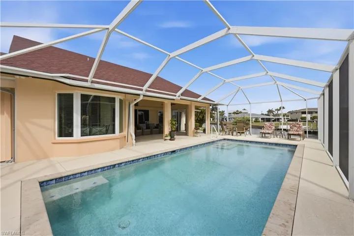 Saltwater Pool, lanai, and outdoor dining space