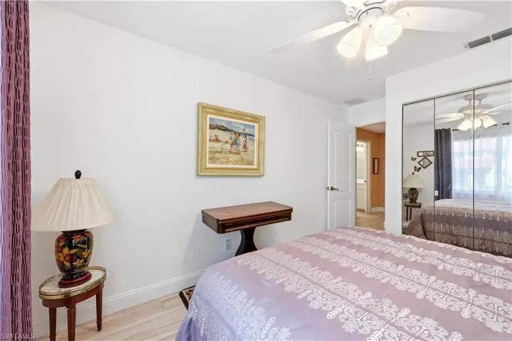 Guest Bedroom with tile flooring, ceiling fan, and a closet