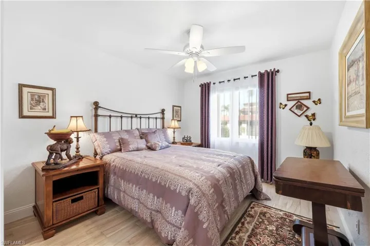 Guest Bedroom with tile floors and ceiling fan
