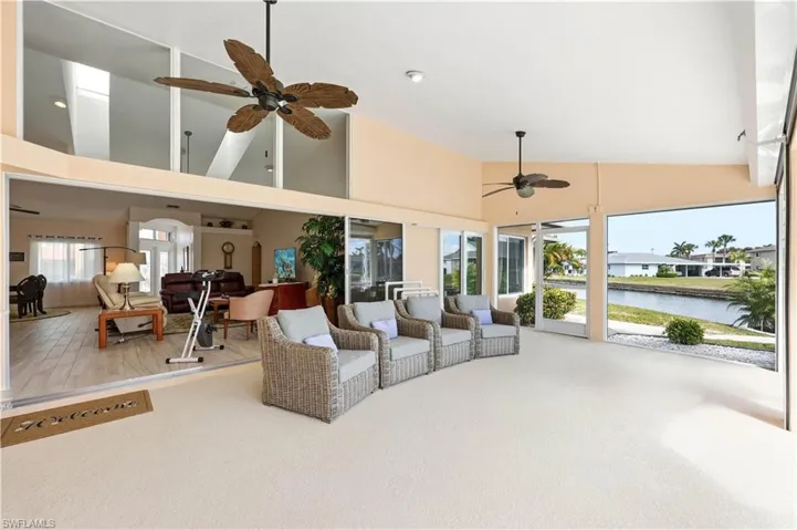 Large Lanai, 2 Ceiling Fans, vaulted ceiling, Electric Roll-down Shutters and a view of the Direct Access Canal.