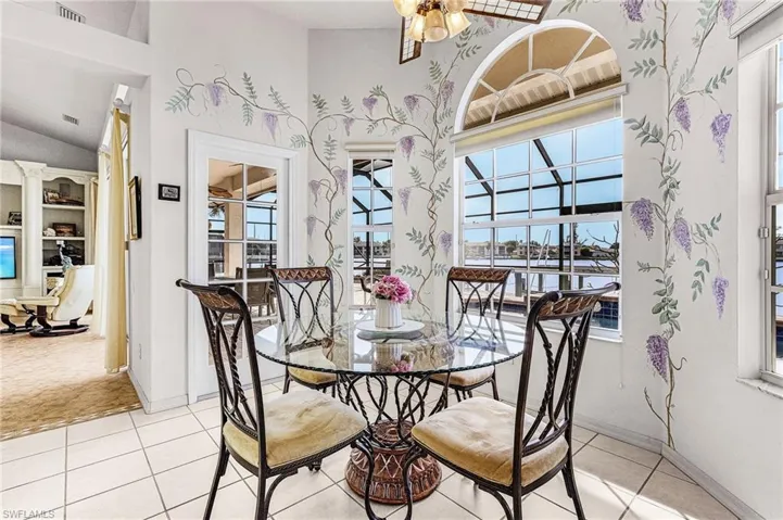 Dining space featuring plenty of natural light, light tile patterned flooring View of the Lake
