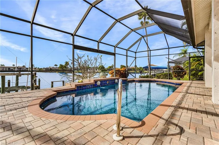 Outdoor pool  featuring a huge lanai with southwester exposure