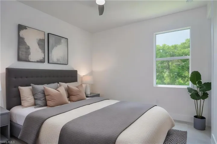 Bedroom with a ceiling fan and baseboards