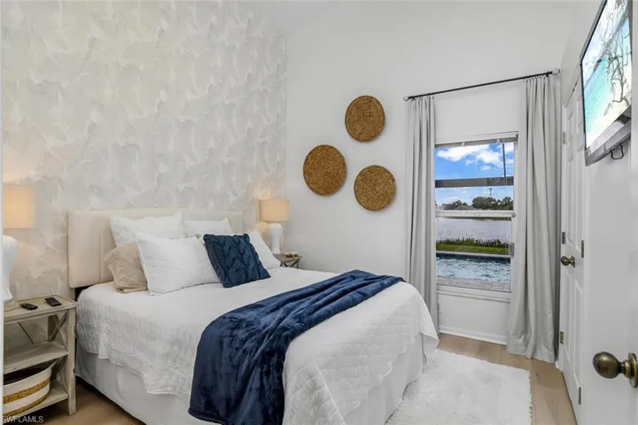 Bedroom with light hardwood / wood-style flooring