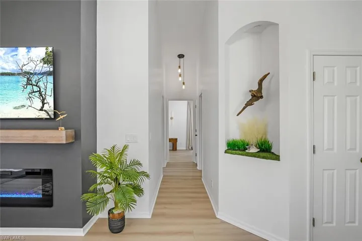 Hallway with light wood-type flooring