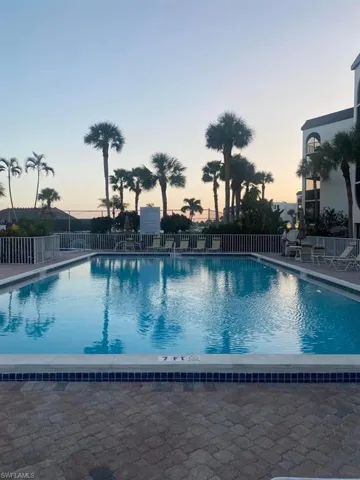 View of pool at dusk