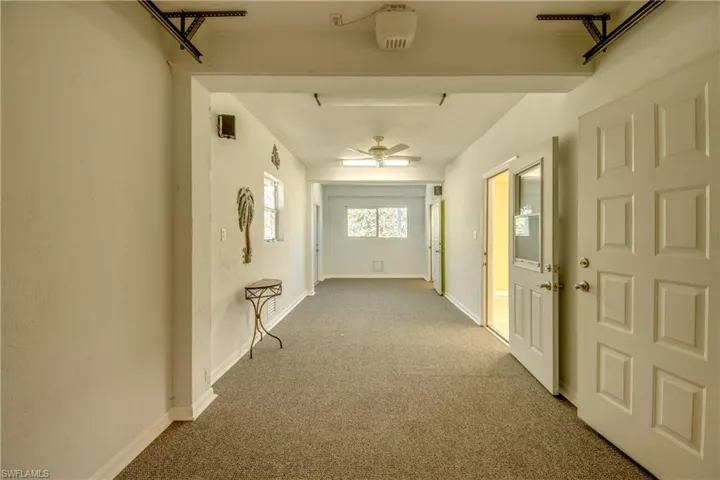 Ground level bonus room with carpet flooring and baseboards