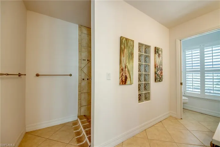 Full bathroom featuring light tile patterned floors and walk in shower