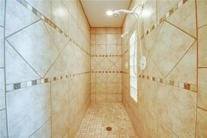 Bathroom featuring a tile shower