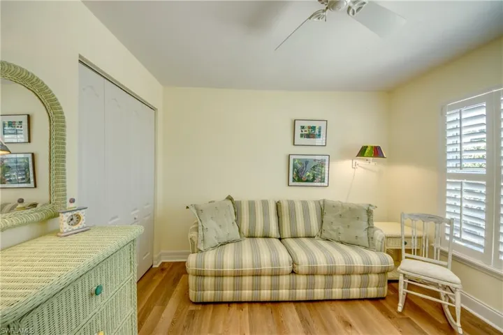 Sitting room featuring wood finished floors and ceiling fan