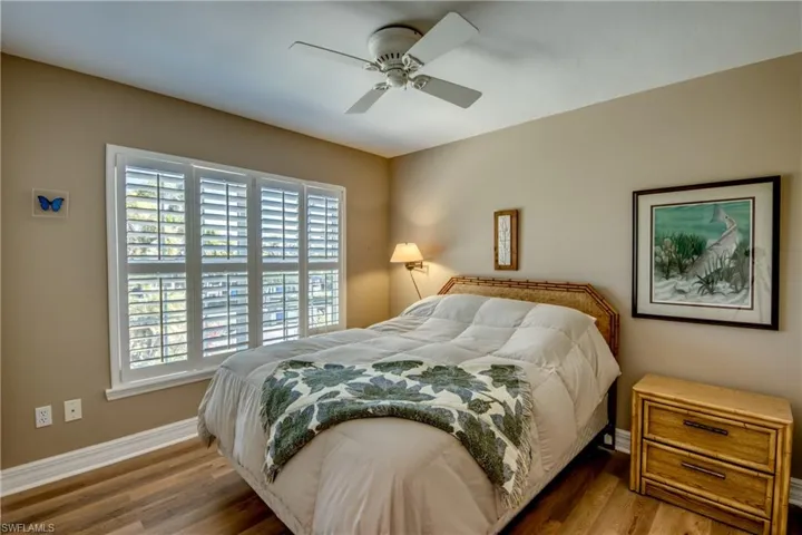 Bedroom featuring wood finished floors and ceiling fan