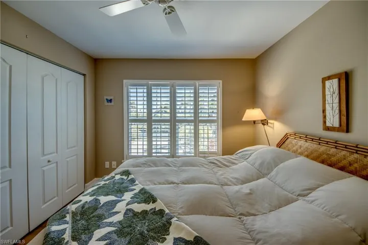 Bedroom featuring a closet and a ceiling fan