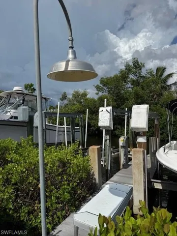 Boat lift and a dock with a fish cleaning station