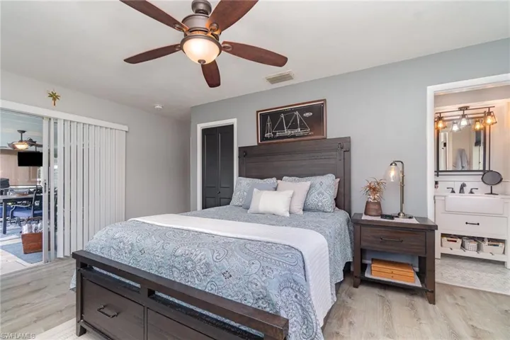 Bedroom featuring ceiling fan and light hardwood / wood-style floors