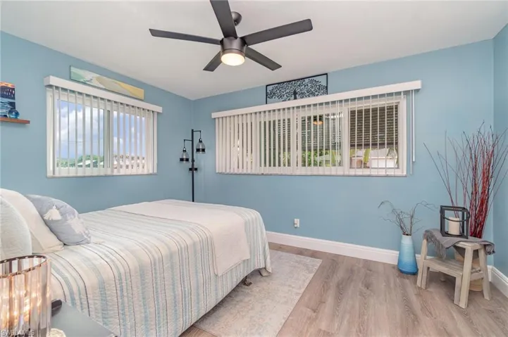 Bedroom featuring hardwood / wood-style floors and ceiling fan