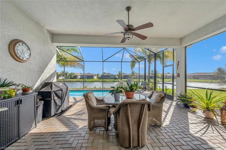 Enjoy a meal around your pool with a beautiful lake view.