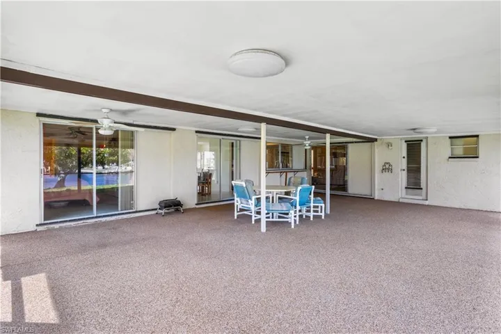 View of patio featuring ceiling fan