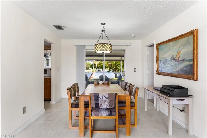 Dining space featuring a textured ceiling