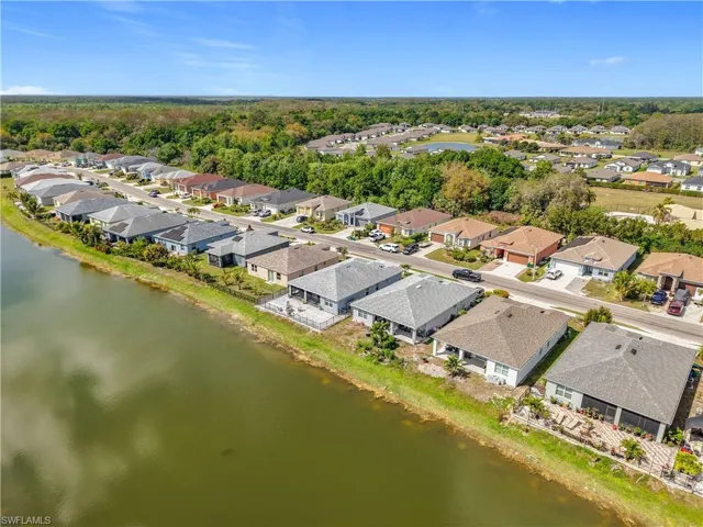Aerial view featuring a residential view and a water view