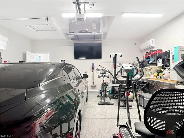 Garage featuring a wall unit AC